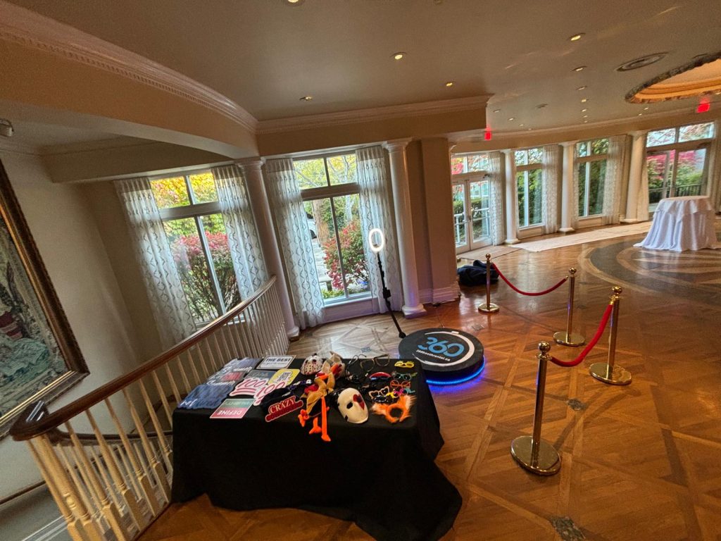 St. Thomas 360 video booth with props and stanchions