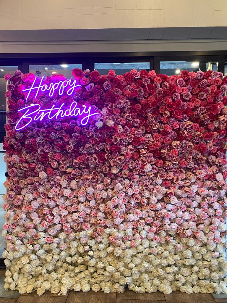 Happy Birthday neon sign and flower wall in St. Thomas for celebrations