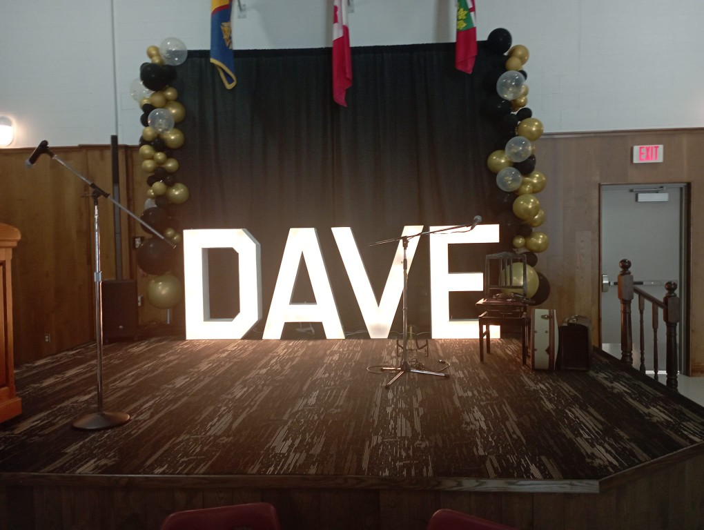 Rent Welland marquee letters with black drapes and balloon pillars to make a statement
